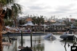Debris scatters an area in the aftermath of Hurricane Michael in Mexico Beach, Fla., Oct. 11, 2018.