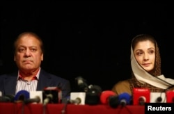 Ousted Pakistani prime minister Nawaz Sharif appears with his daughter Maryam at a news conference at a hotel in London, Britain, July 11, 2018.