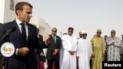 FILE - French President Emmanuel Macron delivers a speech during a press conference ahead of a G5 Sahel force meeting in Nouakchott, Mauritania, July 2, 2018.