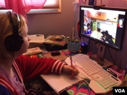 Fifth-grader Cloe Gray, recuperating at her home after surgery, used a home tutor at first but missed the routine of her classes at a Glen Burnie, Maryland, elementary school. Cloe says the robot she now uses gave her the confidence to participate. (C. Presutti/VOA)