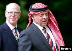 FILE - King Abdullah of Jordan is shown in London May 11, 2014.