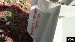 Screen capture from video shot by VOA shows remains of bomb with Russian markings that seems to bolster the activists' claims that Syrian government used cluster bombs, in Azaz, Syria. (VOA)