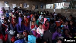 FILE - Eritrean refugees wait to get registered on arrival at the Indabaguna refugee reception and screening center in Tigrai region near the Eritrean border in Ethiopia, Feb. 9, 2016.