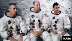 Apollo 10 astronauts Eugene Cernan, Lunar Module Pilot, Thomas Stafford, Commander and John Young, Command Module Pilot are seen in this NASA photograph.