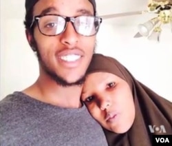 FILE - Abdi Mohamud Nur, shown in this undated photo with his mother, right, is believed to be fighting in Syria.