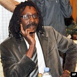 Mahjoub Hussein, secretary general of Sudan Liberation Movement-Revolutionary Forces, attends a meeting with Qatari State Minister for Foreign Affairs Ahmed bin Abdullah al-Mahmud and UN negotiator on Darfur Djibril Bassole in Doha, 25 Jan 2010