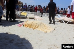FILE - 38 people were killed when a gunman opened fire on a Tunisian beachside hotel in the popular resort of Sousse, Tunisia, June 26, 2015.