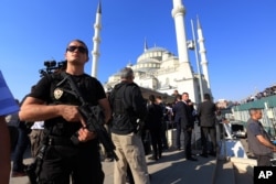 A Turkish special security force member stands during a mass funeral for the victims of a failed military coup last Friday, at Kocatepe Mosque in Ankara, Turkey, July 17, 2016.