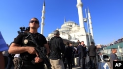 A Turkish special security force member stands guard during a mass funeral for the victims of a failed military coup last Friday, at Kocatepe Mosque in Ankara, Turkey, July 17, 2016.