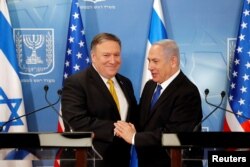 Israeli Prime Minister Benjamin Netanyahu shakes hands with U.S. Secretary of State Mike Pompeo during a meeting at the Ministry of Defence in Tel Aviv, Israel, April 29, 2018