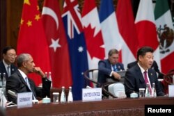 U.S. President Barack Obama watches as Chinese President Xi Jinping speaks at the opening ceremony of the G20 Summit in Hangzhou, Zhejiang province, China, Sept. 4, 2016.