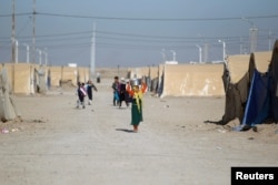 Displaced Iraqi people are seen at the Amriyat al Fallujah camp in Anbar Province, Iraq Jan. 3, 2018.