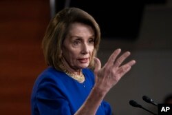 Speaker of the House Nancy Pelosi, D-Calif., talks with reporters during her weekly news conference, on Capitol Hill in Washington, Thursday, Feb. 7, 2019.