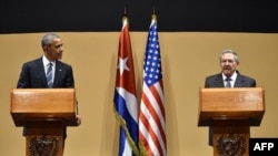 FILE - U.S. President Barack Obama (L) and Cuban President Raul Castro hold a joint press conference after meeting at the Revolution Palace in Havana, March 21, 2016. In Havana last year, Obama told the Cuban people that he came "to bury the last remnants of the Cold War in the Americas.”