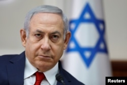 Israel's Prime Minister Benjamin Netanyahu chairs the weekly Cabinet meeting in Jerusalem, Nov. 18, 2018.