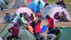 Migrants rest at a camp in Acandi, Colombia, Sept. 14, 2021.