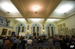 Conductor Jeffrey Douma leads a rehearsal of the current Yale Glee Club.