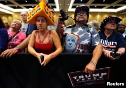 FILE - Supporters rally with Donald Trump in Green Bay, Wisconsin, October 17, 2016.