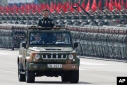 FILE - Chinese President Xi Jinping inspects the People's Liberation Army of the Hong Kong Garrison at the Shek Kong Barracks in Hong Kong, June 30, 2017.