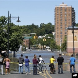 Water from the Passaic River covers the intersection of Main Street and Memorial Drive in Paterson, N.J., where the river overflowed its banks following Hurricane Irene in August 2011.