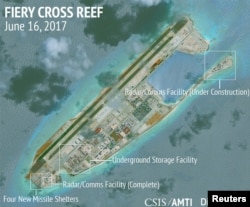 FILE - Construction is shown on Fiery Cross Reef in the Spratly Islands, the disputed South China Sea, in this June 16, 2017, satellite image released by CSIS Asia Maritime Transparency Initiative at the Center for Strategic and International Studies (CSIS).