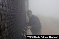 Mounir Abbar, fog manager for Dar Si Hmad, tends to the fog collection nets on Mount Boutmezguida, Morocco, Feb. 21, 2018.