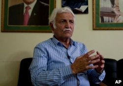 FILE - Pakistani Senator Farhatullah Babar talks to the Associated Press in Islamabad, Pakistan, Oct. 27, 2016.