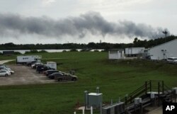 Smoke rises from a SpaceX launch site, Sept. 1, 2016, at Cape Canaveral, Fla. NASA said SpaceX was conducting a test firing of its unmanned rocket when a blast occurred.