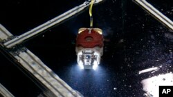 A newly developed robot for underwater investigation of a Fukushima damaged reactor moves through the water at a test facility in Yokosuka near Tokyo, June 15, 2017.