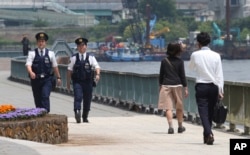 Police officers patrol along the Sumida River in Tokyo, May 23. 2016. Japanese cities have beefed up the security as the country hosts Group of Seven Summit in the Ise-Shima region, central Japan, on May 26 and 27.