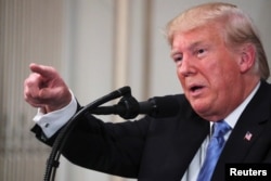 FILE - U.S. President Donald Trump holds a news conference in New York.