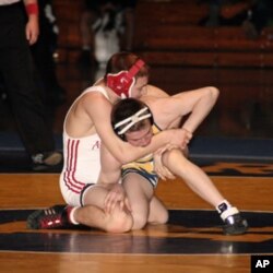 Dane Harlowe (in red & white) wrestling in the 125 lbs (56.7 kilos) Virginia AAA State Championship final on February 19, 2011.