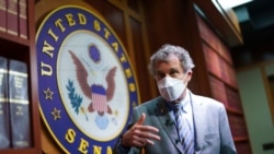 Sen. Sherrod Brown, D-Ohio, talks to reporters at the Capitol in Washington, Sept. 23, 2021.