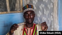 Iliyasu Ningi, a wanzami (traditional barber) holds up the instruments that he uses to perform yankan gishiri. It's a cultural practice similiar to female genital mutilation where a cut is made on the vaginal wall.