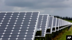 FILE - Some of the more than 37,000 solar panels gather sunlight at the Space Coast Next Generation Solar Center, in Merritt Island, Florida, May 13, 2015.