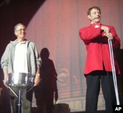 A tourist, joining the show aboard the Branson Belle showboat, is apparently enjoying the experience.