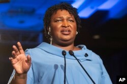 FILE -Georgia Democratic gubernatorial candidate Stacey Abrams addresses supporters during an election night watch party in Atlanta, Nov. 6, 2018.