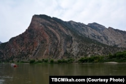 Mikah describes this rock formation as “a giant wave that’s about to crest over, except it’s all rocks and you see each layer.”