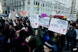 FILE - Thousands of demonstrators protest the anticipated immigration policies of president-elect Donald Trump during a march, Nov. 13, 2016 in New York.
