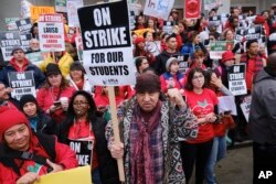 Actor, musician and activist, Steven Van Zandt, center, supports striking teachers on the picket in front of Hamilton High School in Los Angeles, Jan. 16, 2019.