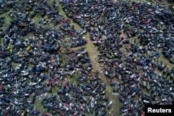 FILE - Wasted motorbikes are seen at a recycling center in Nanjing, Jiangsu province, China, March 27, 2017.