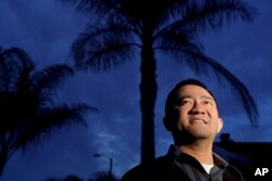Steven Mai poses for a photo in the little Saigon area of Westminster, California, Jan. 3, 2017.