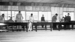 UN delegate Lt. Gen. William K. Harrison, Jr. (seated left), and Korean People’s Army and Chinese People’s Volunteers delegate Gen. Nam Il (seated right) sign the Korean War armistice agreement at Panmunjom, Korea, July 27, 1953.
