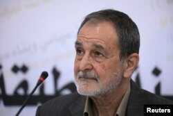 FILE - Riad Darar, co-chairman of the Syrian Democratic Council, is seen during a council meeting in Tabqa, Syria, July 16, 2018.