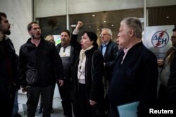 Members of the "I Won't Pay" movement protest outside a Public Power Corporation (PPC) branch in Athens, Greece, March 17, 2017.