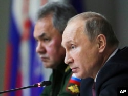 Putin attends a meeting while visiting the Military Academy of Strategic Rocket Troops of the Peter the Great in Balashikha, outside Moscow, December 22, 2017.