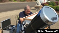 Amateur astronomer Mike Conley, of Salem, Oregon, is part of a project led by the National Solar Observatory to have citizen-scientists across the U.S. photograph the event in an effort to create a live movie of its path.