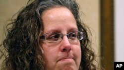 Alexa MacPherson, a victim of clergy sex abuse, reacts, Dec. 20, 2017, in Boston, to the death of Cardinal Bernard Law, the disgraced Boston archbishop.