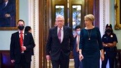 Senate Minority Leader Mitch McConnell, R-Ky., returns to his office from the Senate chamber before votes, at the Capitol in Washington, Sept. 30, 2021.