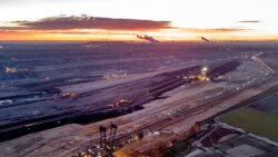 FILE - Bucket wheel excavators are mining coal at the Garzweiler open-cast coal mine in Luetzerath, Germany, Oct.25, 2021.